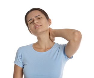 Photo of Young woman suffering from neck pain on white background