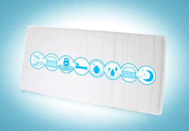 Image of Modern comfortable orthopedic mattress on light blue background