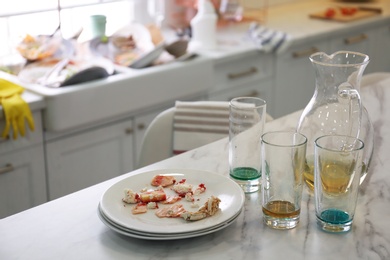 Dirty dishes in kitchen after new year party