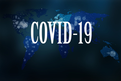 Corona crash. Text COVID-19 and world map on dark background