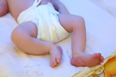 Photo of Newborn child under ultraviolet light in hospital, closeup