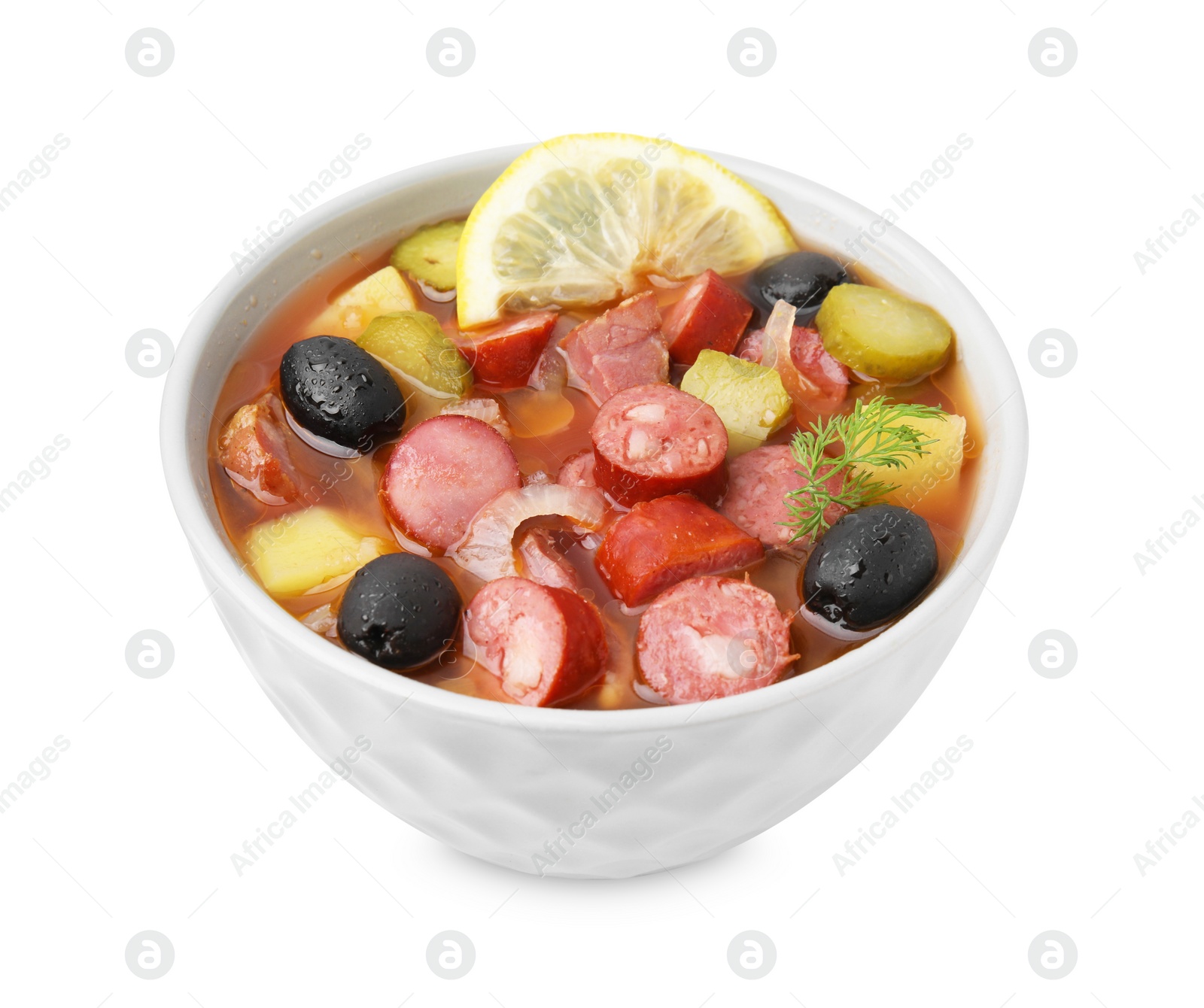 Photo of Meat solyanka soup with thin dry smoked sausages in bowl isolated on white