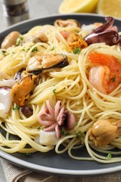 Delicious pasta with sea food on table, closeup