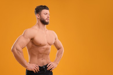 Handsome muscular man on orange background, space for text. Sexy body