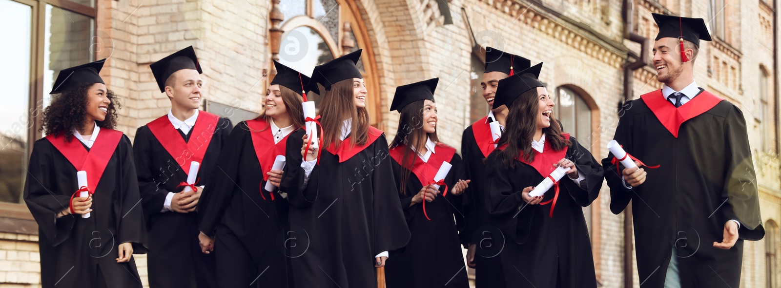 Image of Happy students with diplomas near campus. Banner design