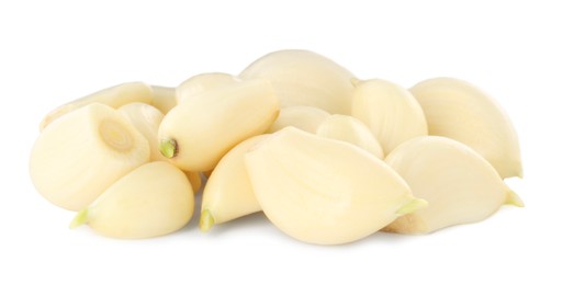 Photo of Peeled cloves of fresh garlic isolated on white