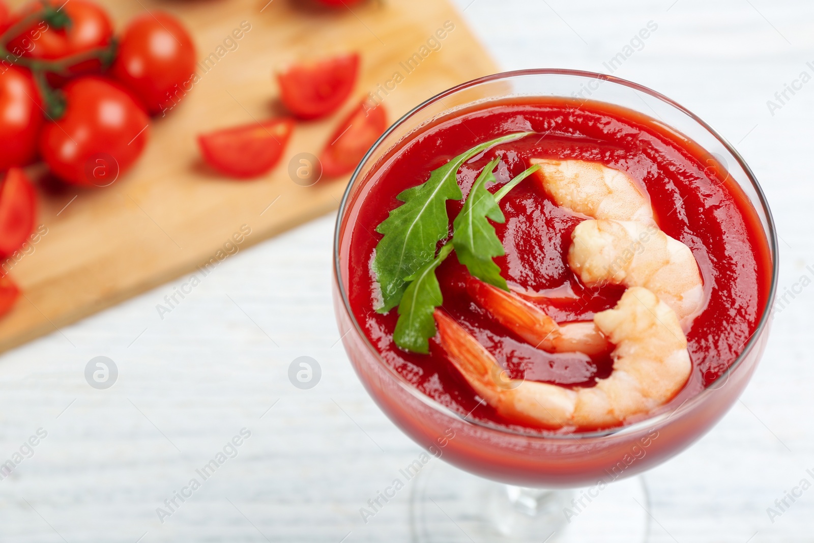 Photo of Delicious shrimp cocktail with tomato sauce, closeup