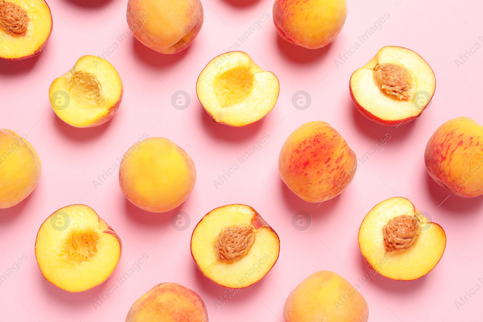 Photo of Flat lay composition with ripe peaches on color background