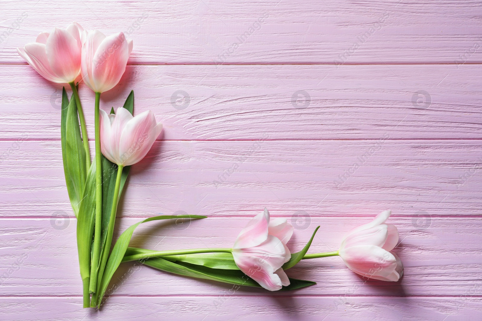 Photo of Beautiful composition with tulips for Mother's Day on wooden background