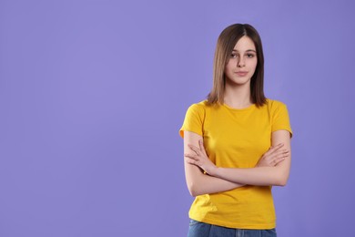 Photo of Portrait of cute teenage girl on violet background. Space for text