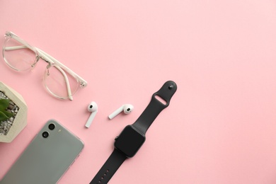 Photo of Flat lay composition with stylish smart watch on pink background. Space for text