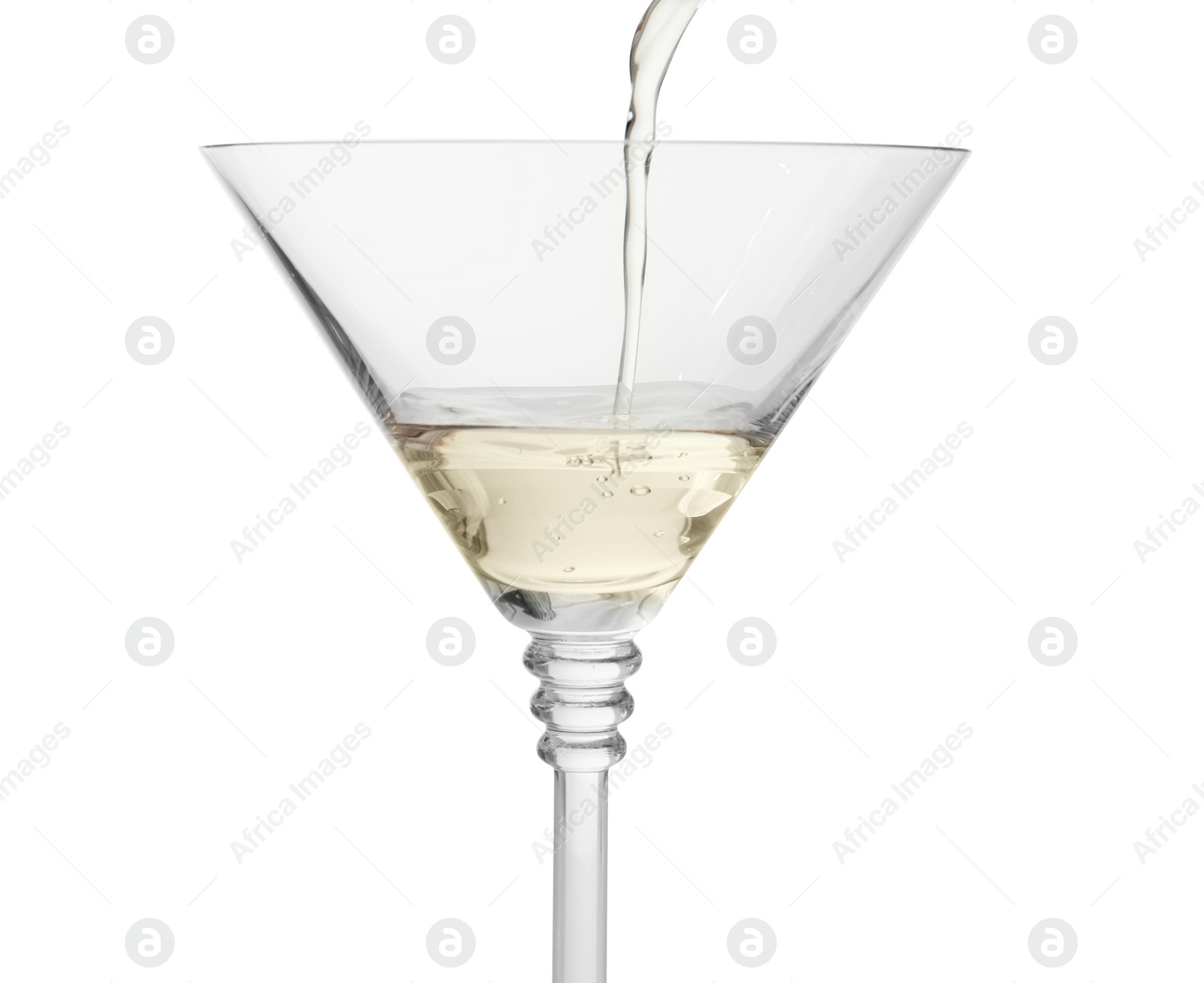 Photo of Pouring martini from bottle into glass on white background