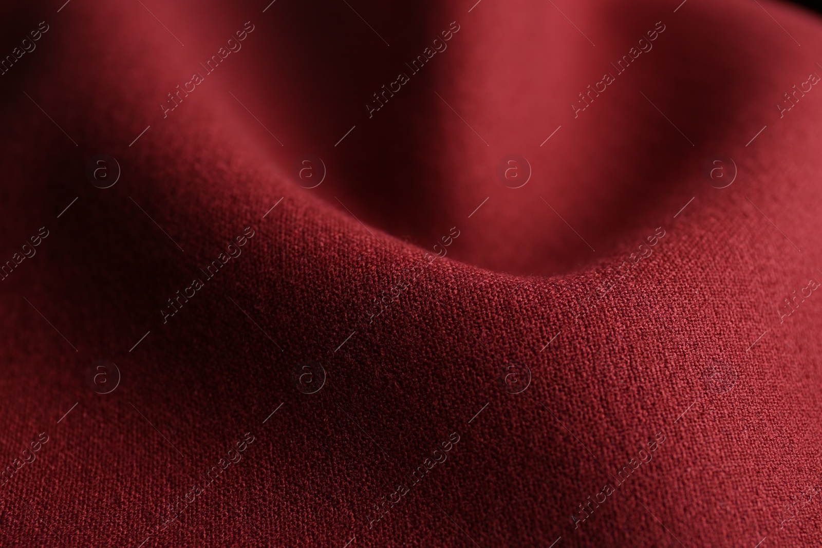 Photo of Texture of beautiful red fabric as background, closeup