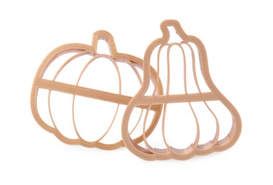Photo of Cookie cutters in shape of pumpkin on white background