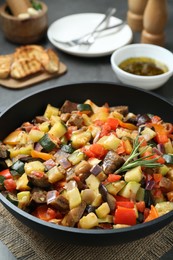 Photo of Delicious ratatouille served on table, closeup view