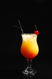 Photo of Glass of cocktail Sex on the Beach, black background