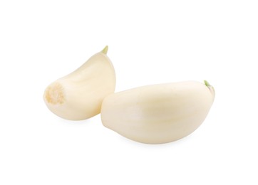 Photo of Peeled cloves of garlic isolated on white