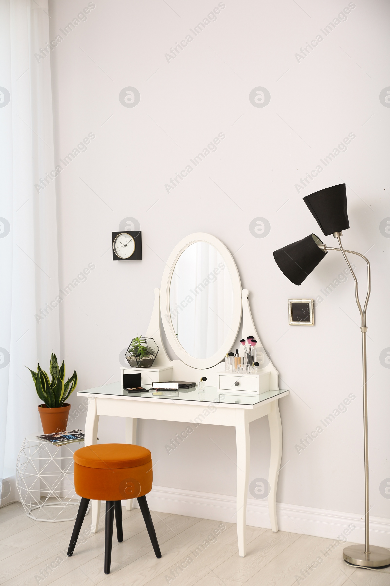 Photo of Dressing table with mirror in stylish room interior
