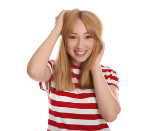 Portrait of beautiful young woman with blonde hair on white background