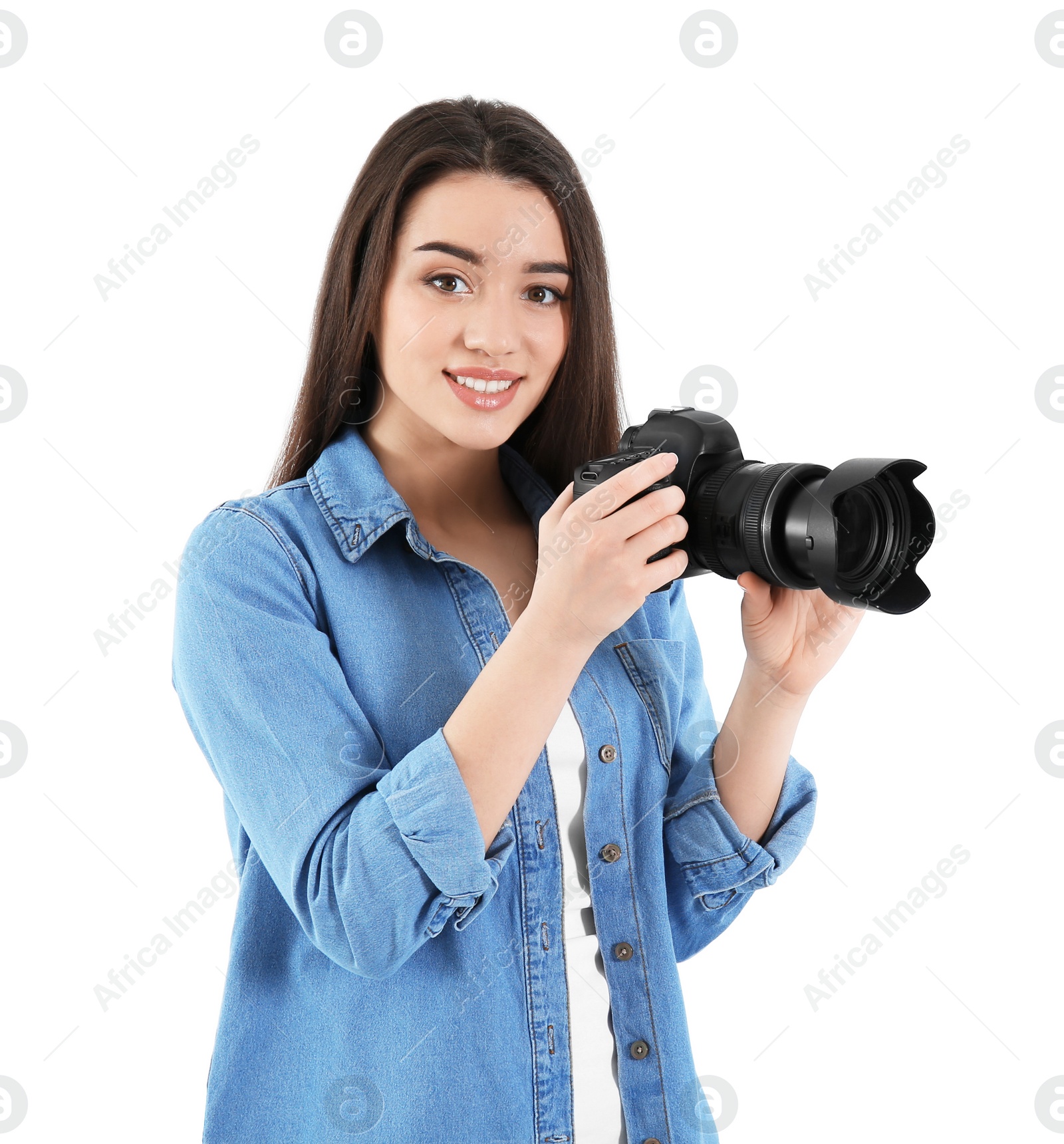 Photo of Female photographer with camera on light background