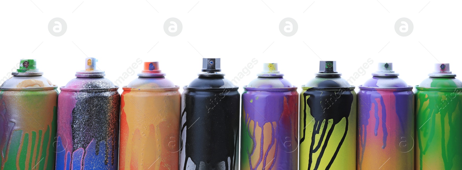 Photo of Used cans of spray paints on white background. Graffiti supplies