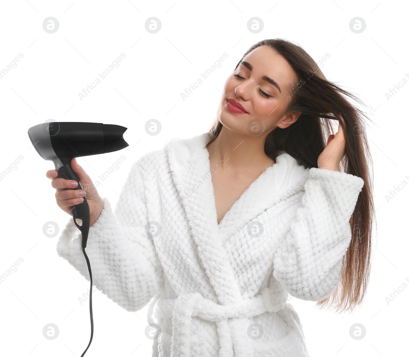 Photo of Beautiful young woman using hair dryer on white background