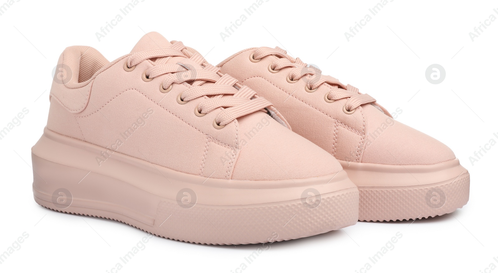 Photo of Pair of comfortable pink shoes on white background