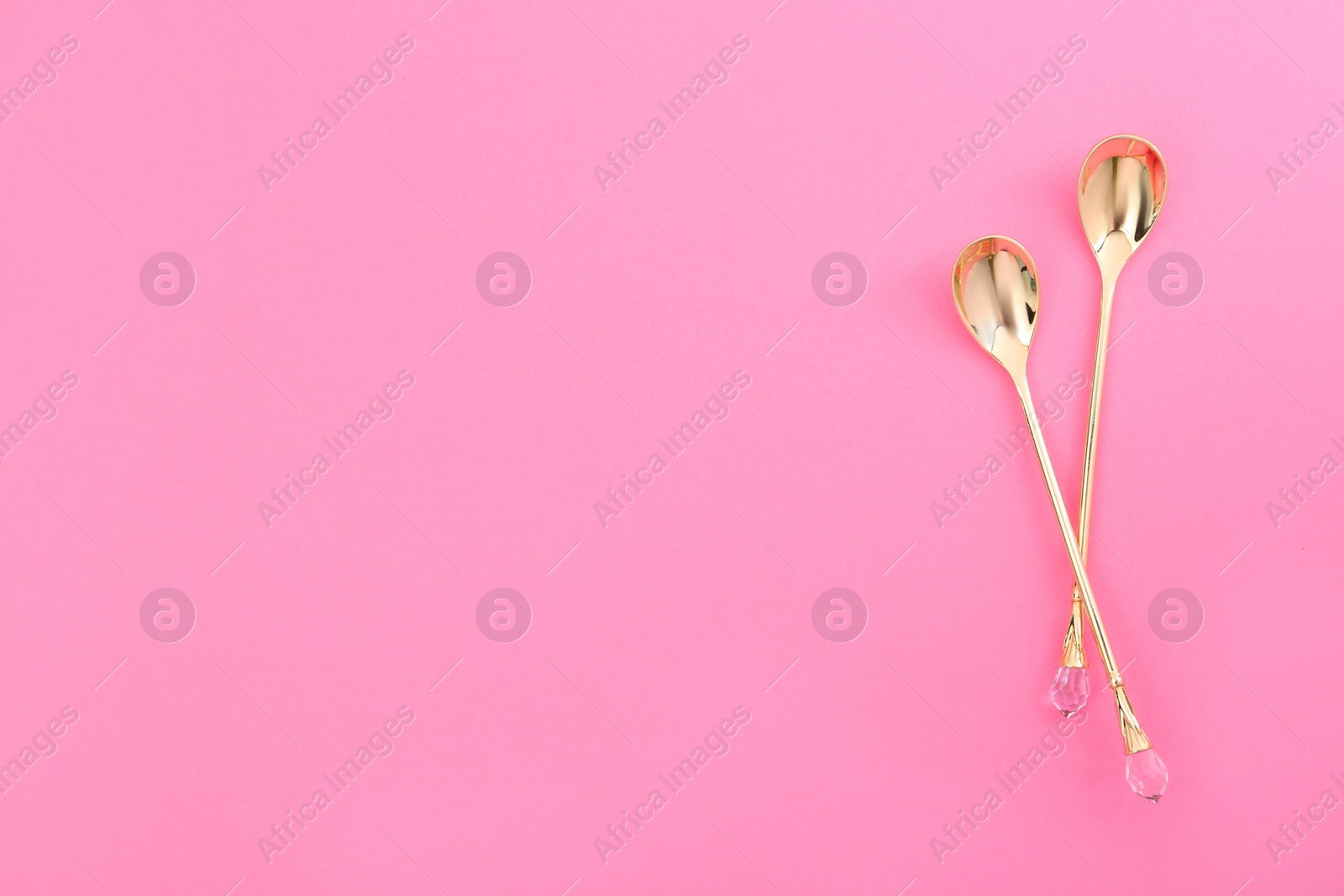 Photo of Clean tea spoons and space for text on color background, flat lay