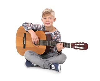 Photo of Little boy playing guitar isolated on white