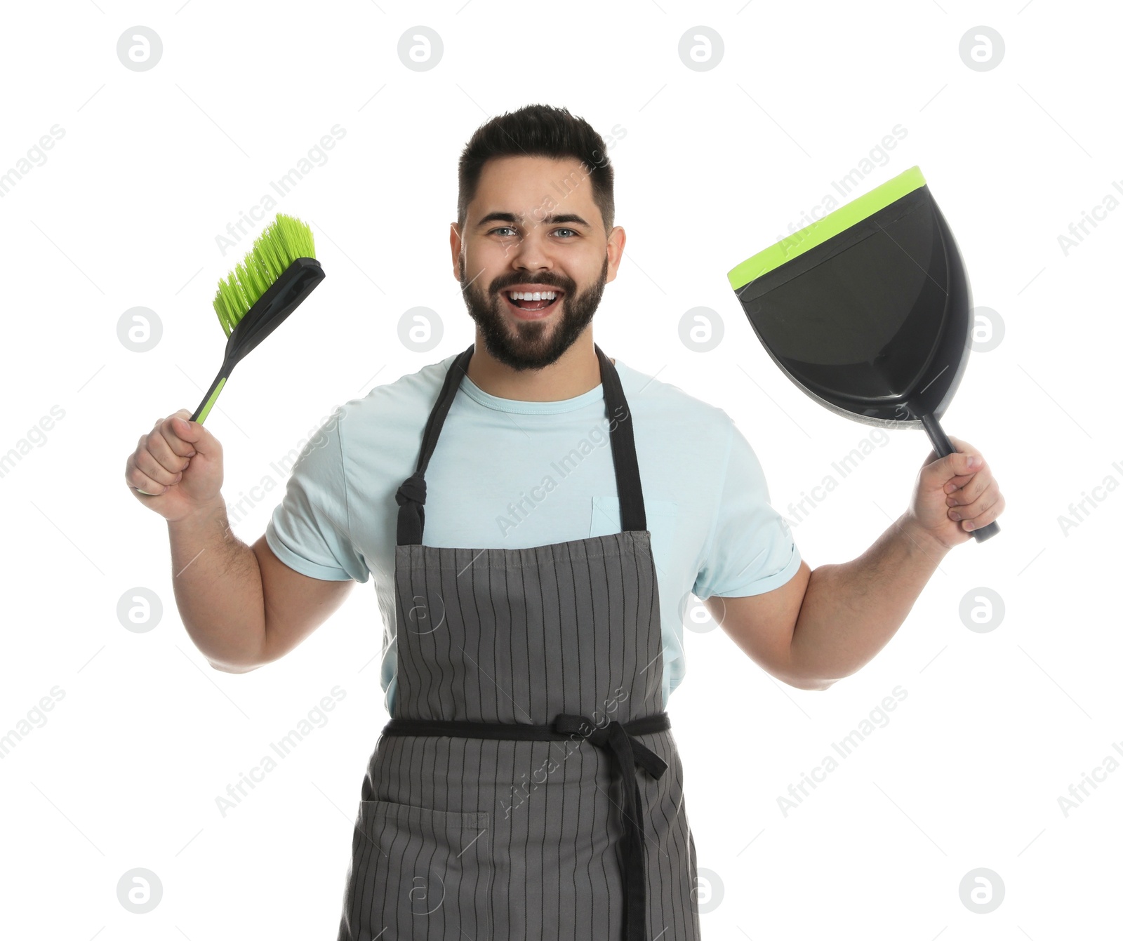 Photo of Young man with brush and dustpan on white background