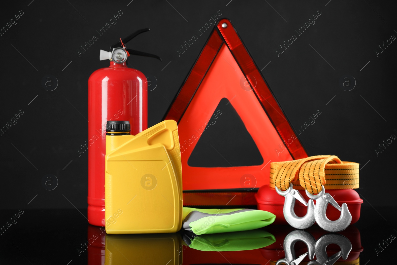 Photo of Set of car safety equipment on black background