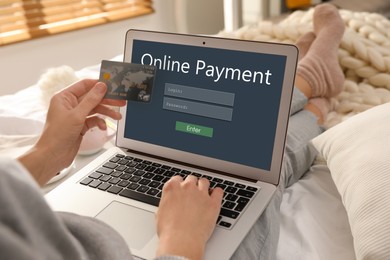 Woman using laptop for online payment indoors, closeup