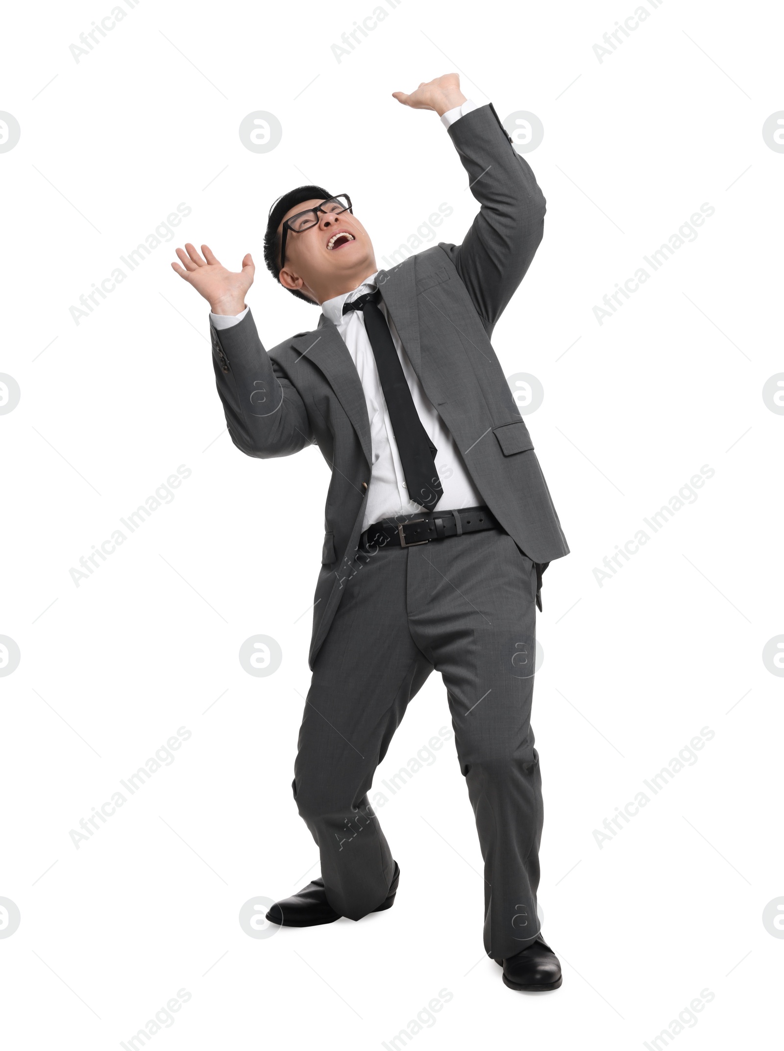 Photo of Scared businessman in suit posing on white background