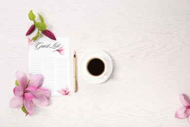 Guest list, coffee, pen and beautiful flowers on white wooden table, flat lay. Space for text