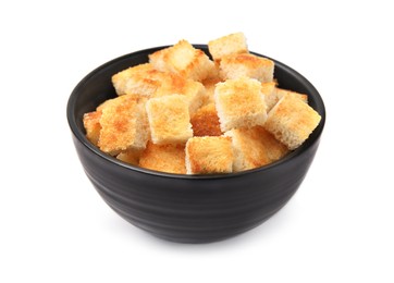 Delicious crispy croutons in bowl on white background