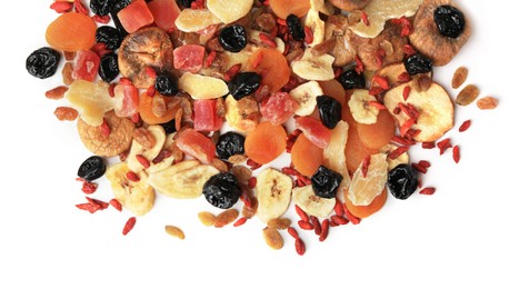 Photo of Pile of different tasty dried fruits on white background, top view