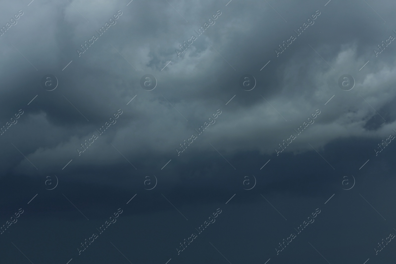 Photo of Sky with heavy rainy clouds on grey day