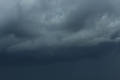 Sky with heavy rainy clouds on grey day