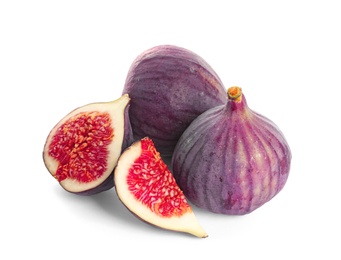 Whole and cut purple figs on white background