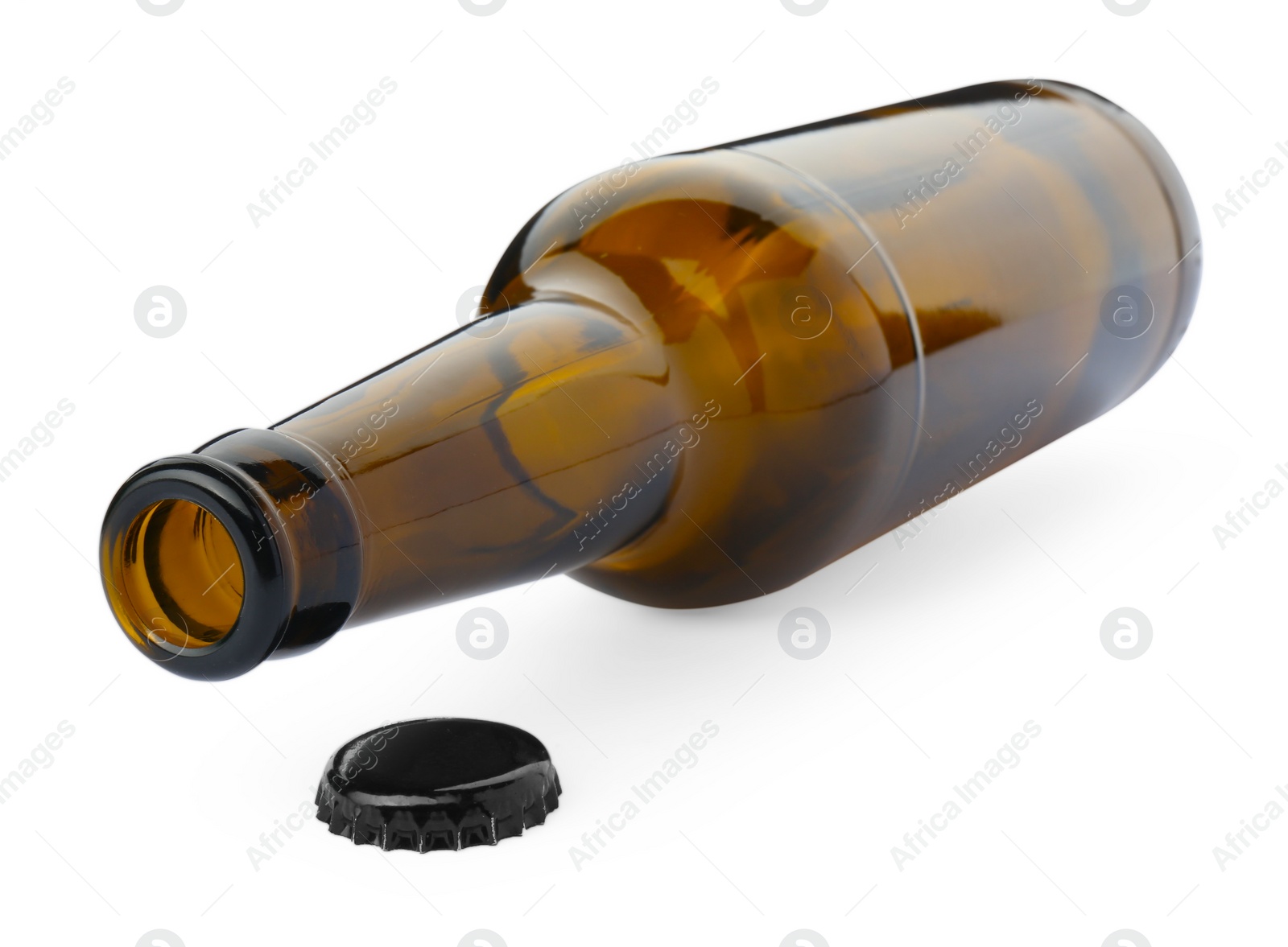 Photo of One empty brown beer bottle and cap isolated on white