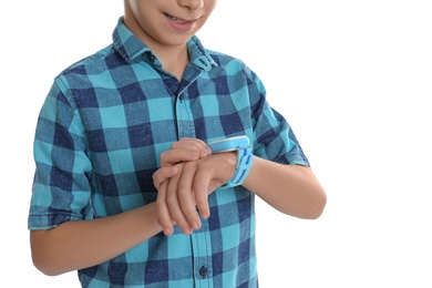 Boy with stylish smart watch on white background, closeup