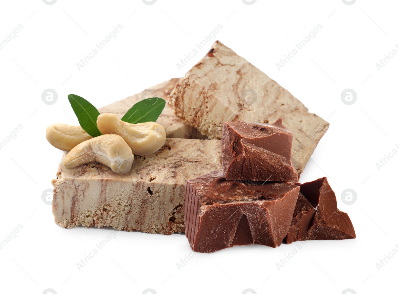 Image of Tasty halva, cashew nuts, pieces of chocolate and green leaves isolated on white