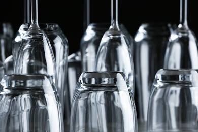 Set of empty glasses on black background, closeup