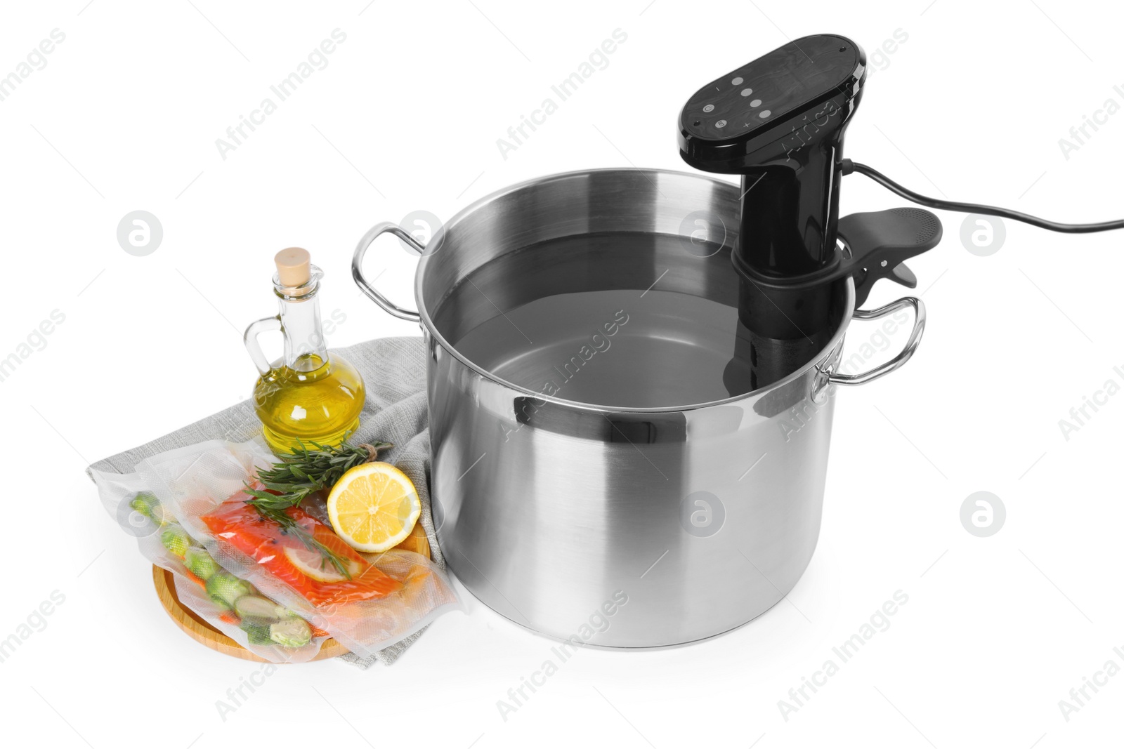 Photo of Thermal immersion circulator in pot and ingredients on white background. Sous vide cooking