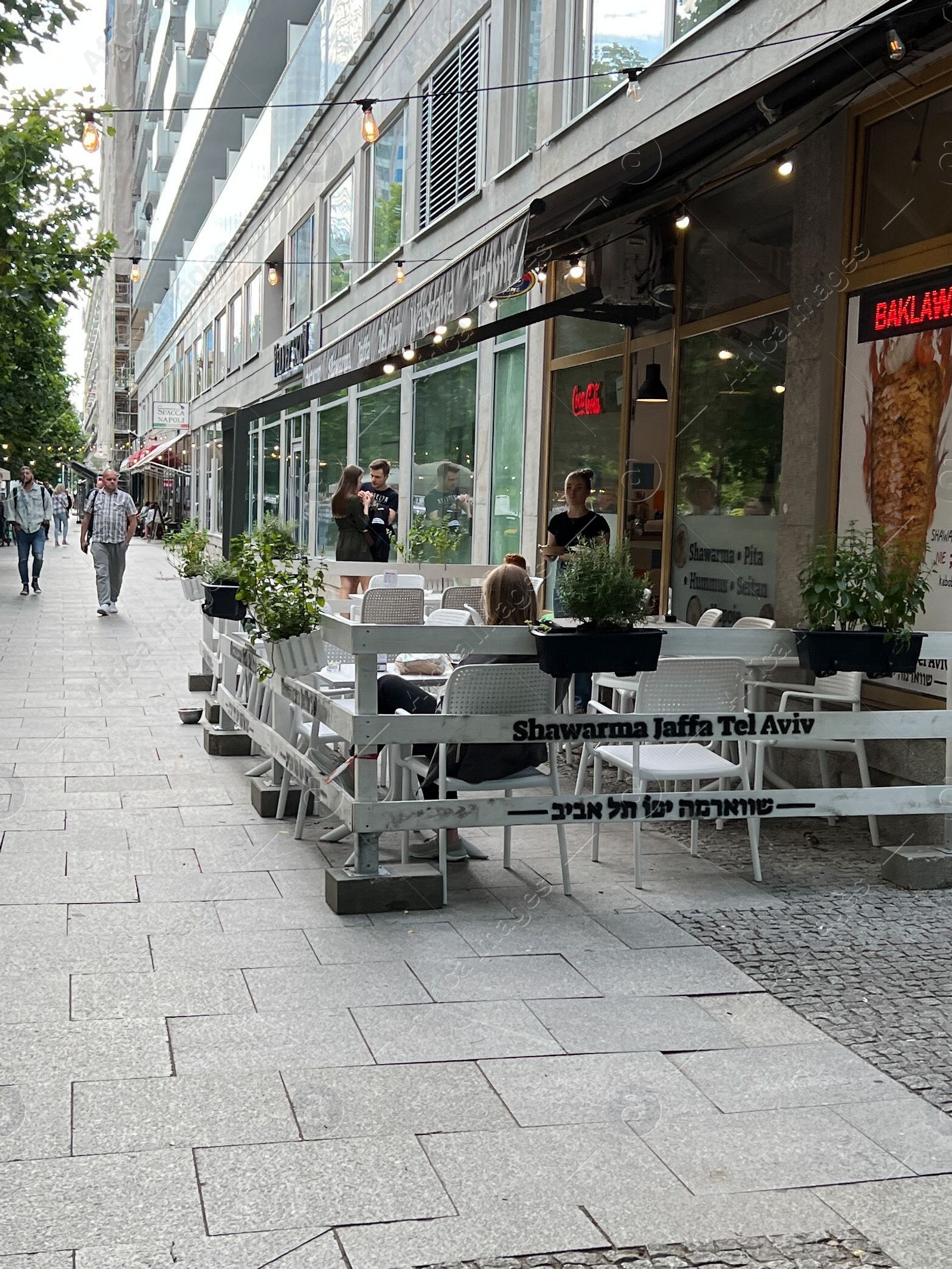 Photo of WARSAW, POLAND - JULY 17, 2022: Beautiful view of modern cafe with outdoor terrace