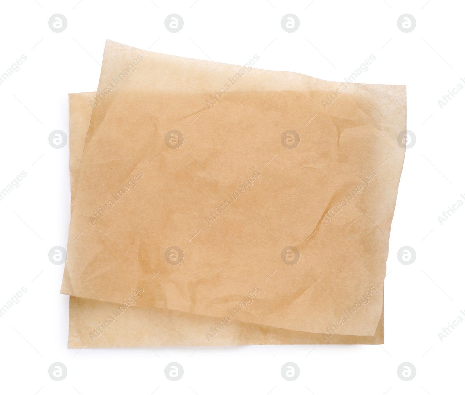 Photo of Sheets of brown baking paper on white background, top view