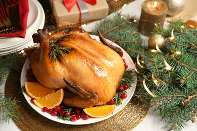 Delicious roasted turkey served for Christmas dinner on table