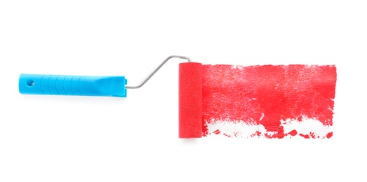 Photo of Roller brush with red paint on white background, top view