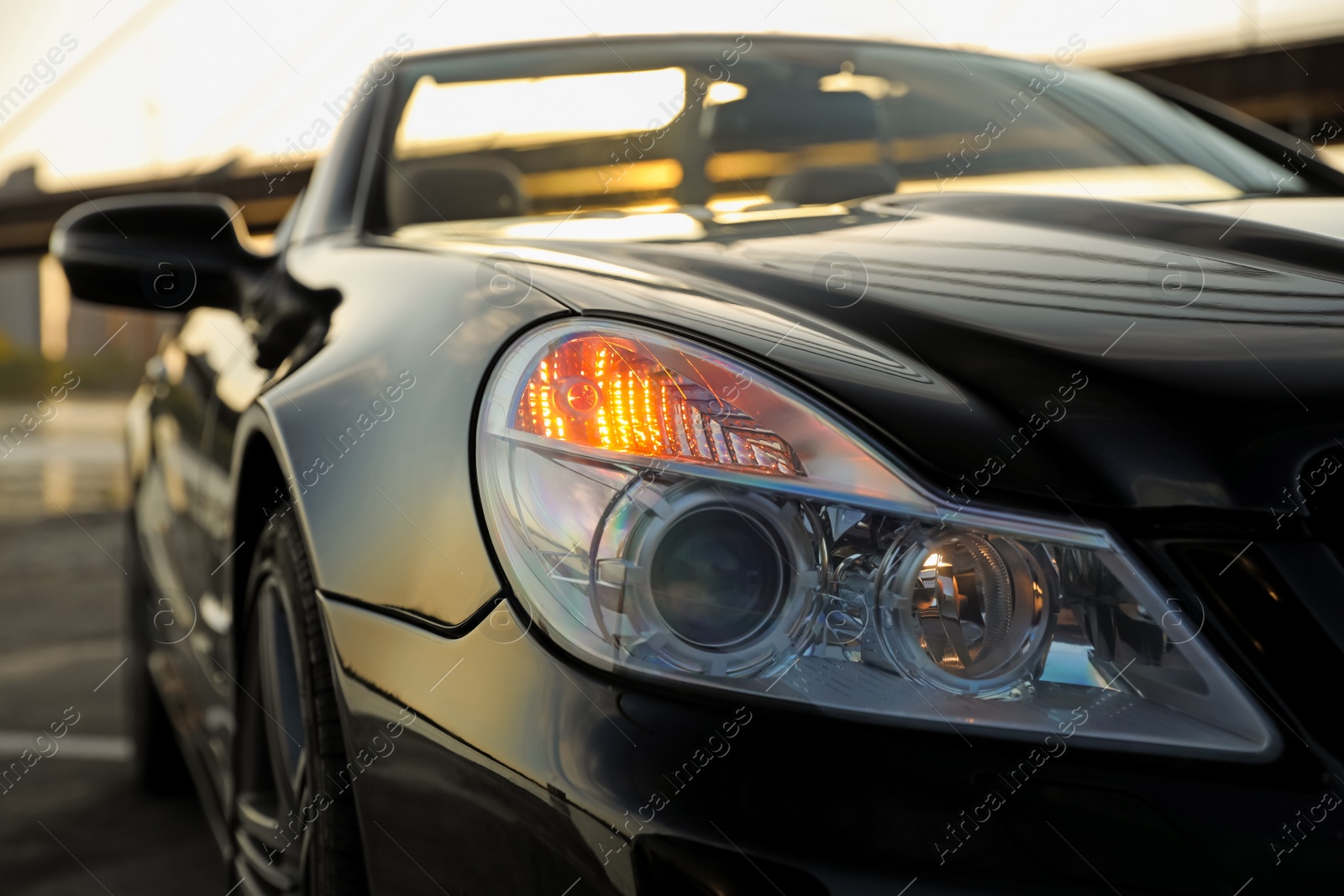 Photo of Luxury black convertible car outdoors, closeup view