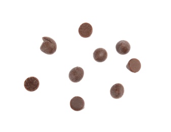 Photo of Delicious dark chocolate chips on white background, flat lay